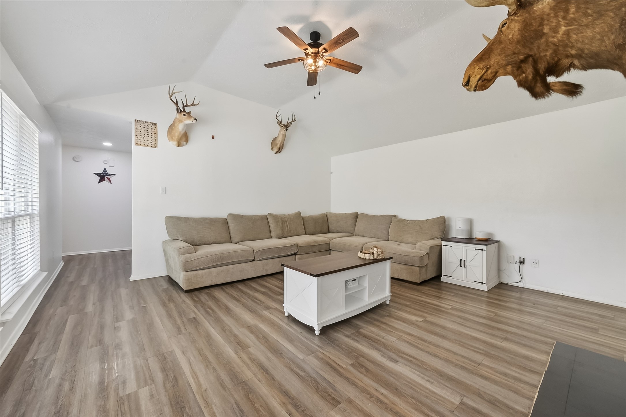 2526 Spring Dusk Drive Spring, TX 77373 - Photo 6 of 33 a living room with furniture and a wooden floor