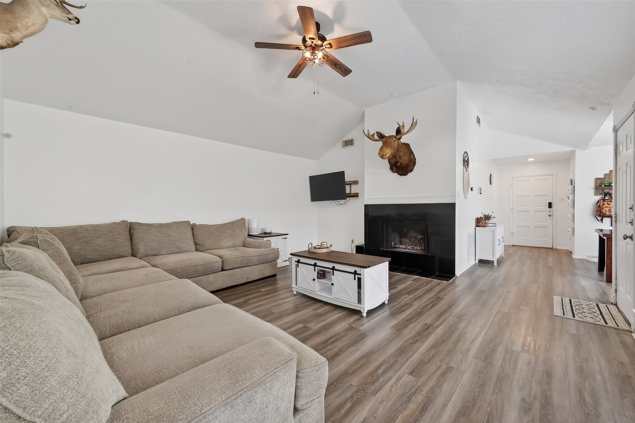 2526 Spring Dusk Drive Spring, TX 77373 - Photo 7 of 33 a living room with furniture a fireplace and wooden floor