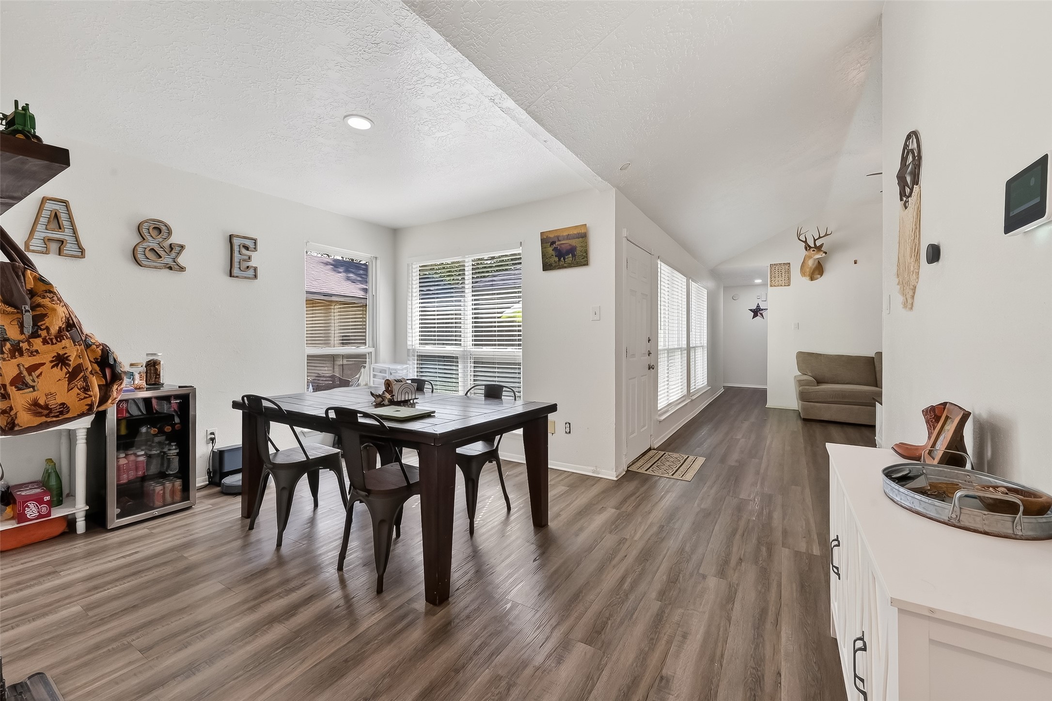 2526 Spring Dusk Drive Spring, TX 77373 - Photo 10 of 33 a view of a dining room with furniture and wooden floor