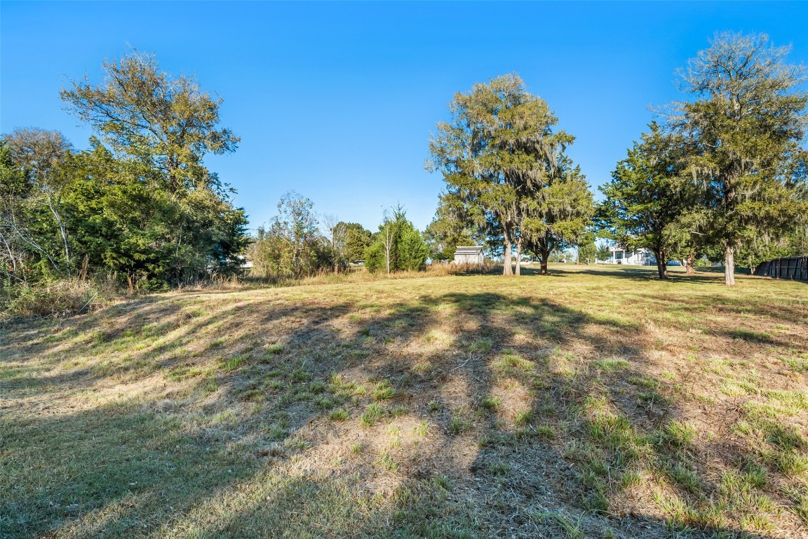 0 Paradise Drive Coldspring, TX 77331 - Photo 2 of 12 a backyard of a house with lots of green space
