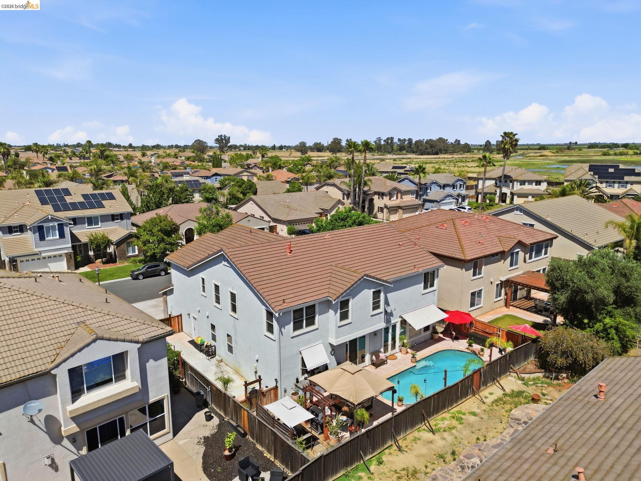 3438 Keystone Loop Discovery Bay, CA 94505 - Photo 55 of 57 an aerial view of multiple houses with a big yard