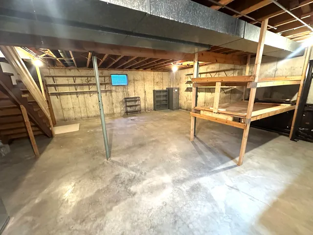 a view of an empty room with wooden walls