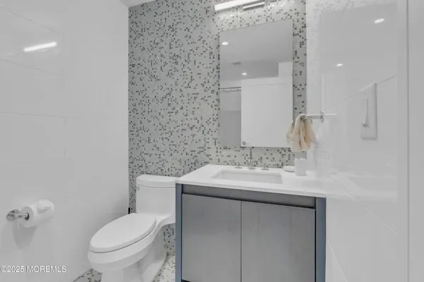 a bathroom with a shower and a glass door