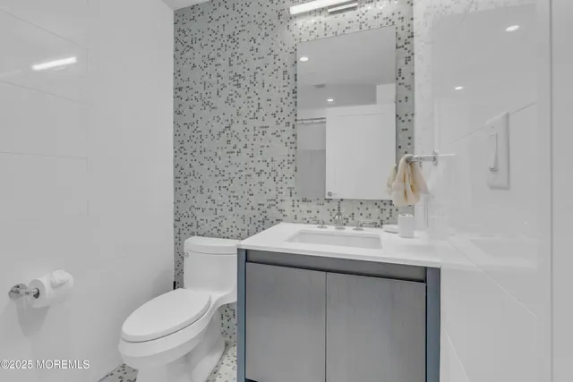 a bathroom with a shower and a glass door