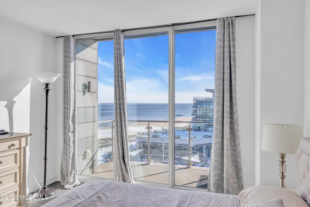 a bathroom with a tub shower sink and mirror