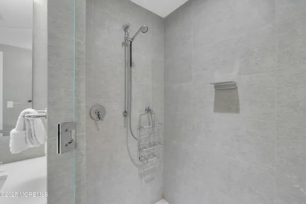 a bathroom with a toilet and shower