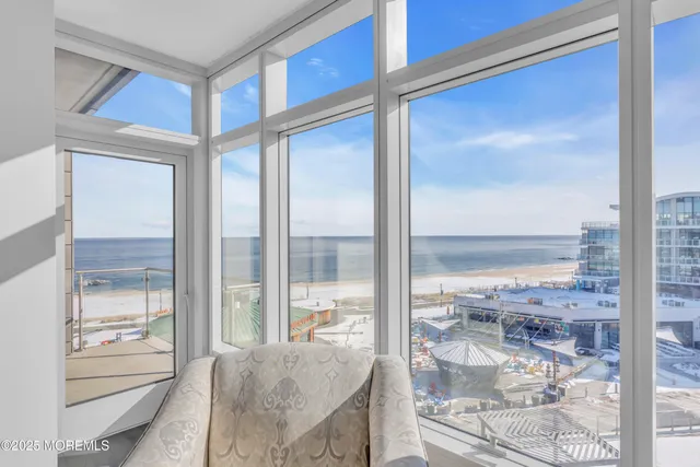 a living room with a large window and table