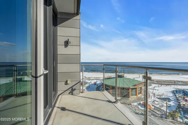 a bedroom with a large window and a bed