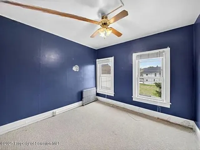 a view of an empty room with window