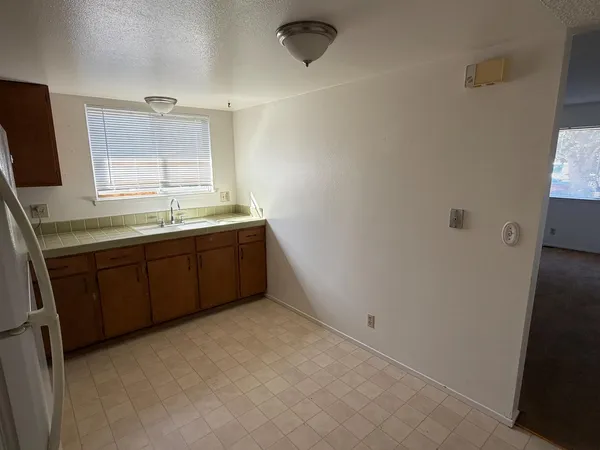 a bathroom with a sink a toilet and bathtub
