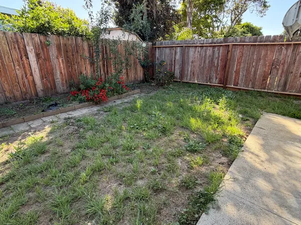 a view of a backyard with green space