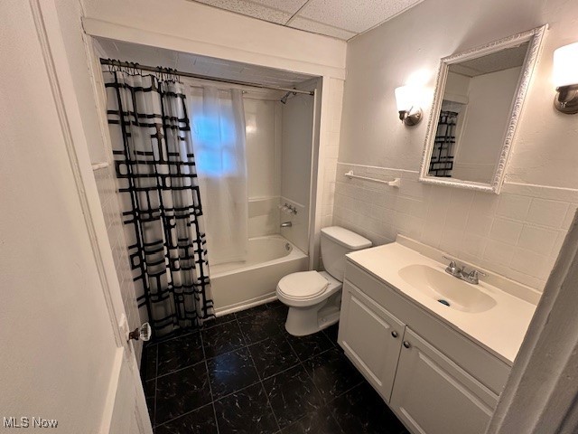 1612 Hillcrest Road Cleveland, OH 44118 - Photo 12 of 29 Full bathroom with vanity, toilet, tile walls, and shower / bathtub combination with curtain