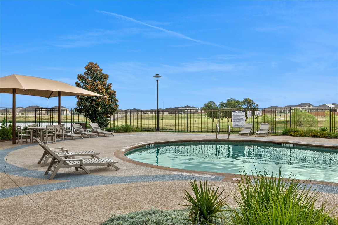 5205 Sidesaddle Drive Georgetown, TX 78626 - Photo 17 of 26 Community pool with a patio