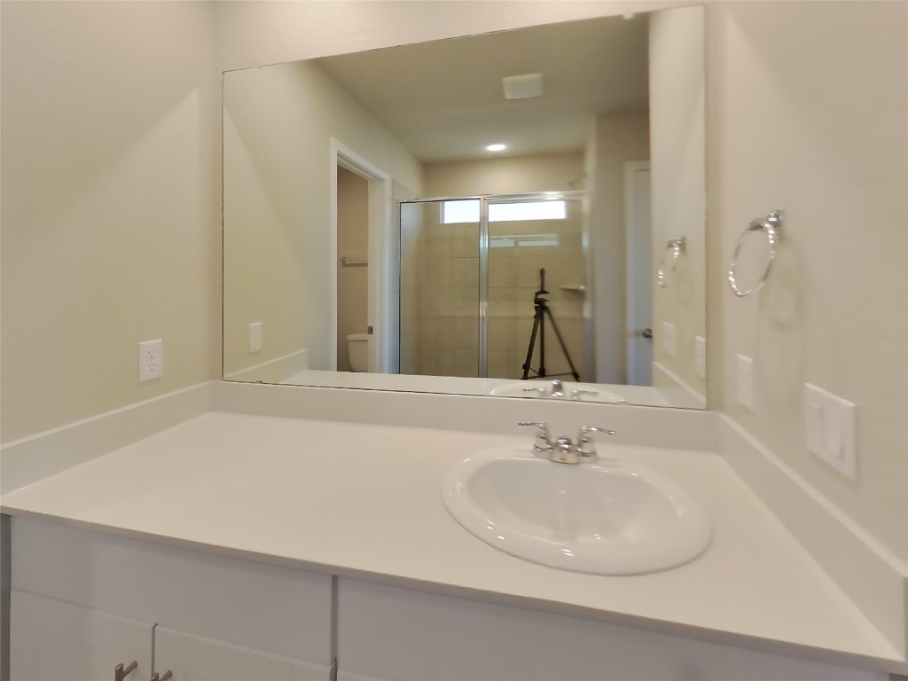5205 Sidesaddle Drive Georgetown, TX 78626 - Photo 7 of 26 Bathroom featuring vanity and a stall shower
