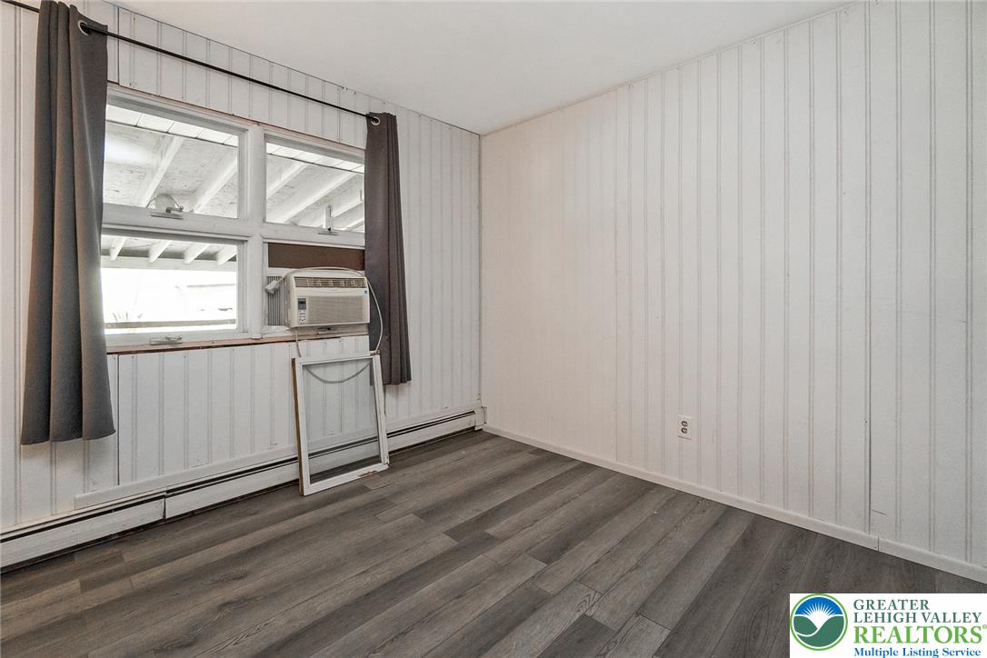 135 Haney Road Kunkletown, PA 18058 - Photo 30 of 53 an empty room with wooden floor and windows