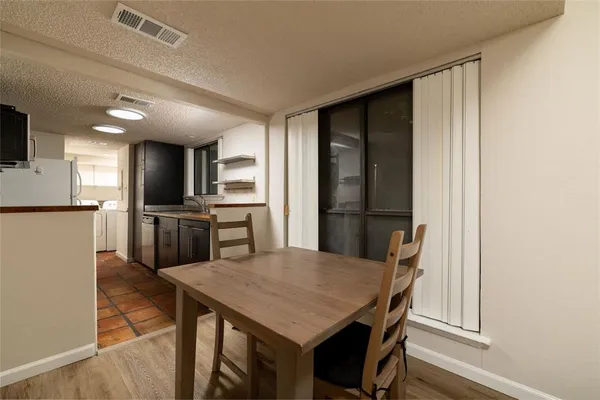 a kitchen with a table and chairs