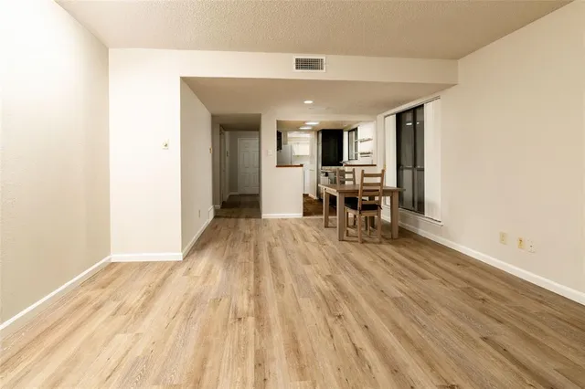 a view of a living room and dining room
