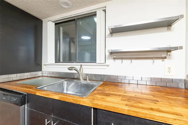 a view of a sink and a window