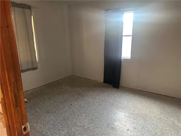 an empty room with a mirror