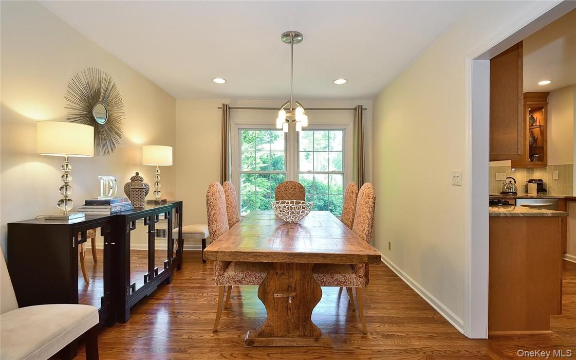 9 Franklin Avenue Rye, NY 10580 - Photo 14 of 35 a view of a dining room with furniture a chandelier and wooden floor