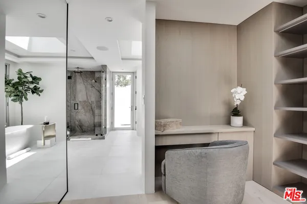 a bathroom with a shower and a sink