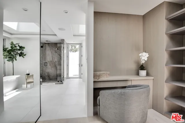 a bathroom with a shower and a sink