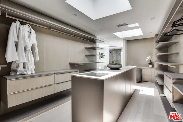 a kitchen with stainless steel appliances a sink and cabinets