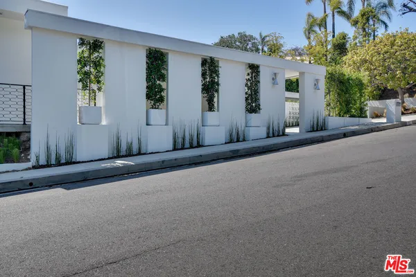 a view of a house with a street