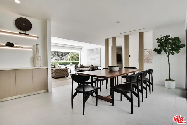 a view of a dining room with furniture and window