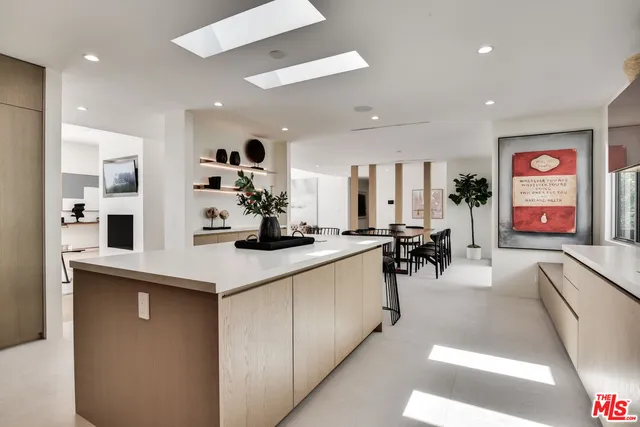 a large white kitchen with lots of counter space
