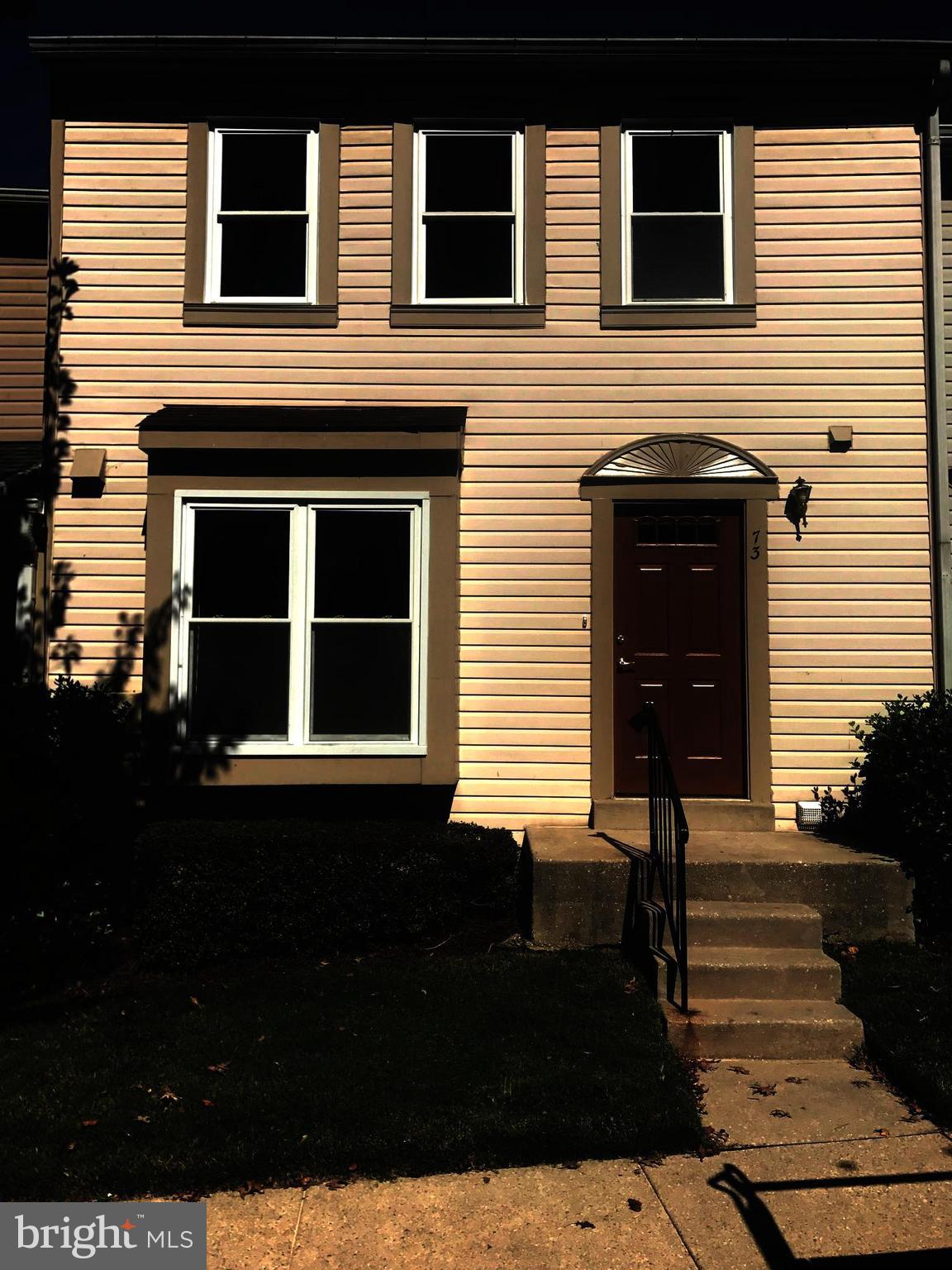 73 Kinsman Silver Spring Silver Spring, MD 20901 - Photo 1 of 9 a front view of a house with a yard