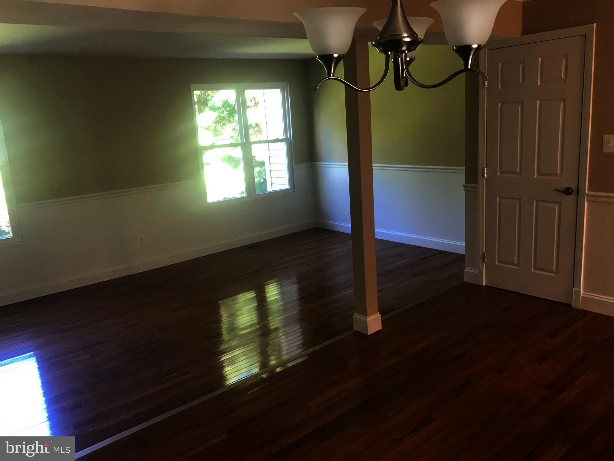 73 Kinsman Silver Spring Silver Spring, MD 20901 - Photo 6 of 9 a view of empty room with wooden floor and fan