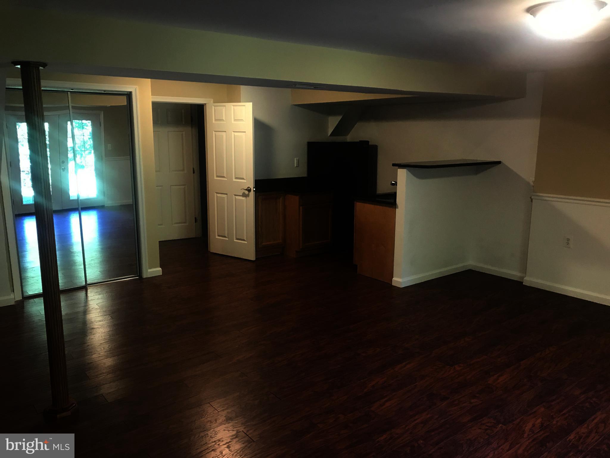 73 Kinsman Silver Spring Silver Spring, MD 20901 - Photo 8 of 9 a view of empty room with wooden floor and stairs