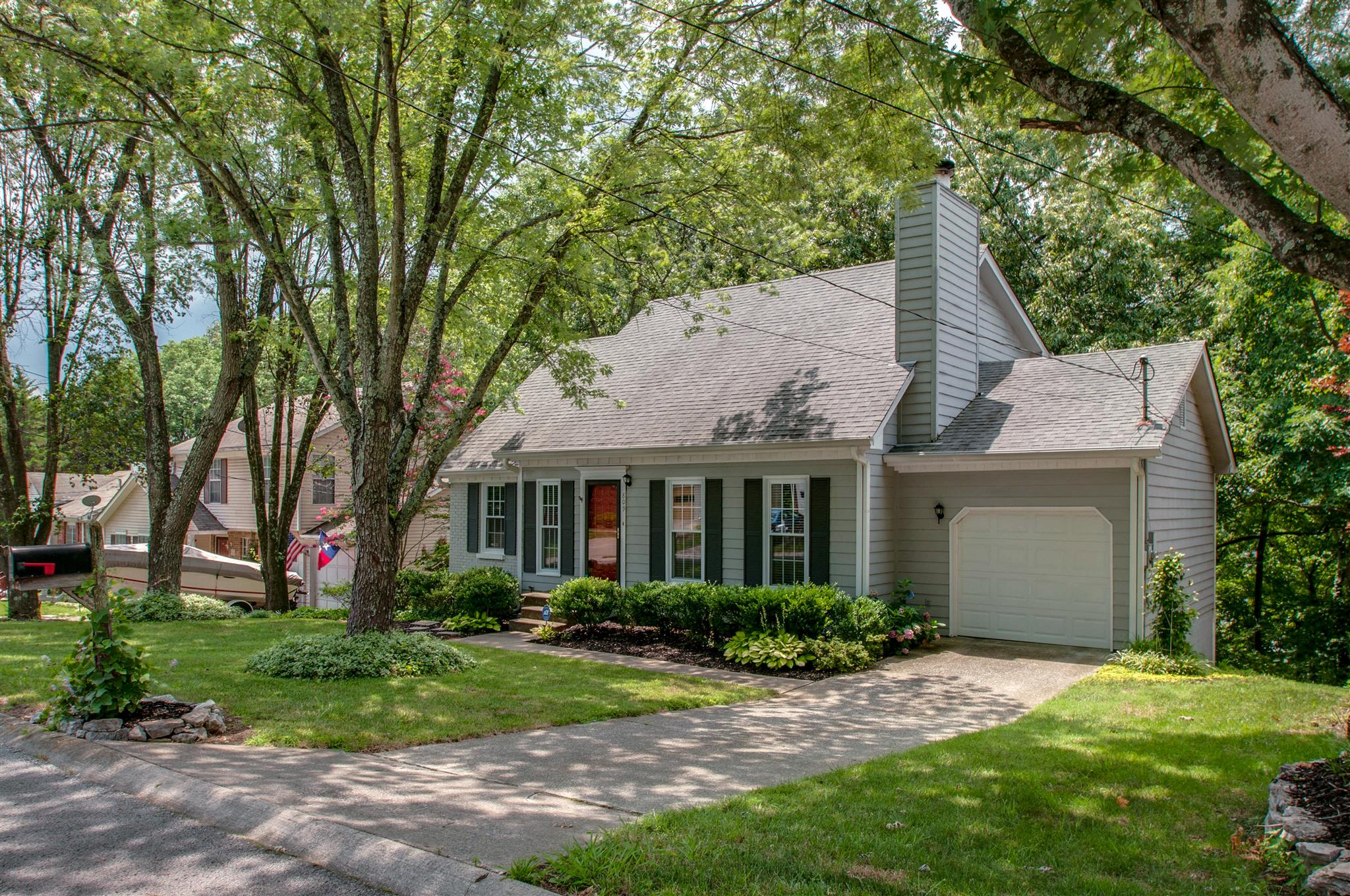809 Bishopsgate Road Antioch, TN 37013 - Photo 1 of 16 a front view of a house with a yard