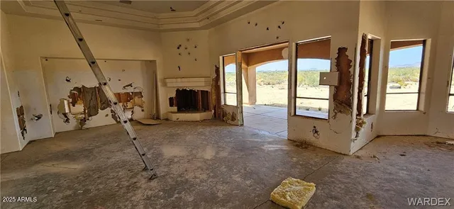 a view of a livingroom with furniture and a fireplace