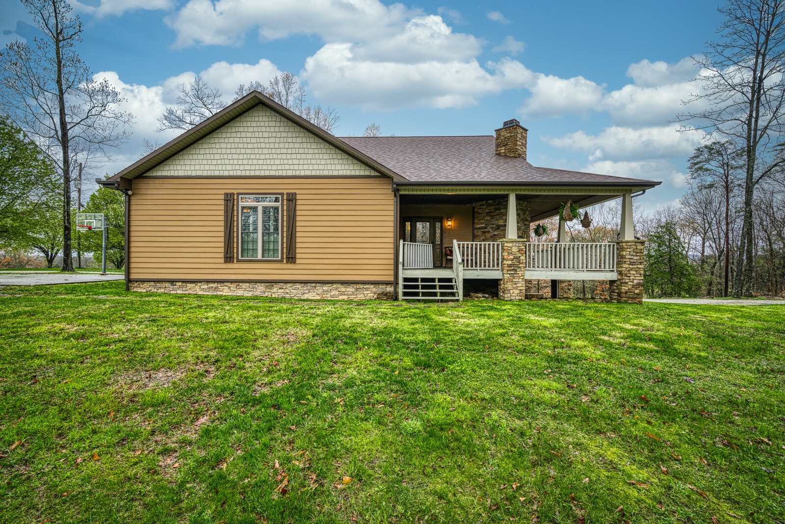 642 Campground Road Livingston, TN 38570 - Photo 1 of 49 a front view of a house with a yard