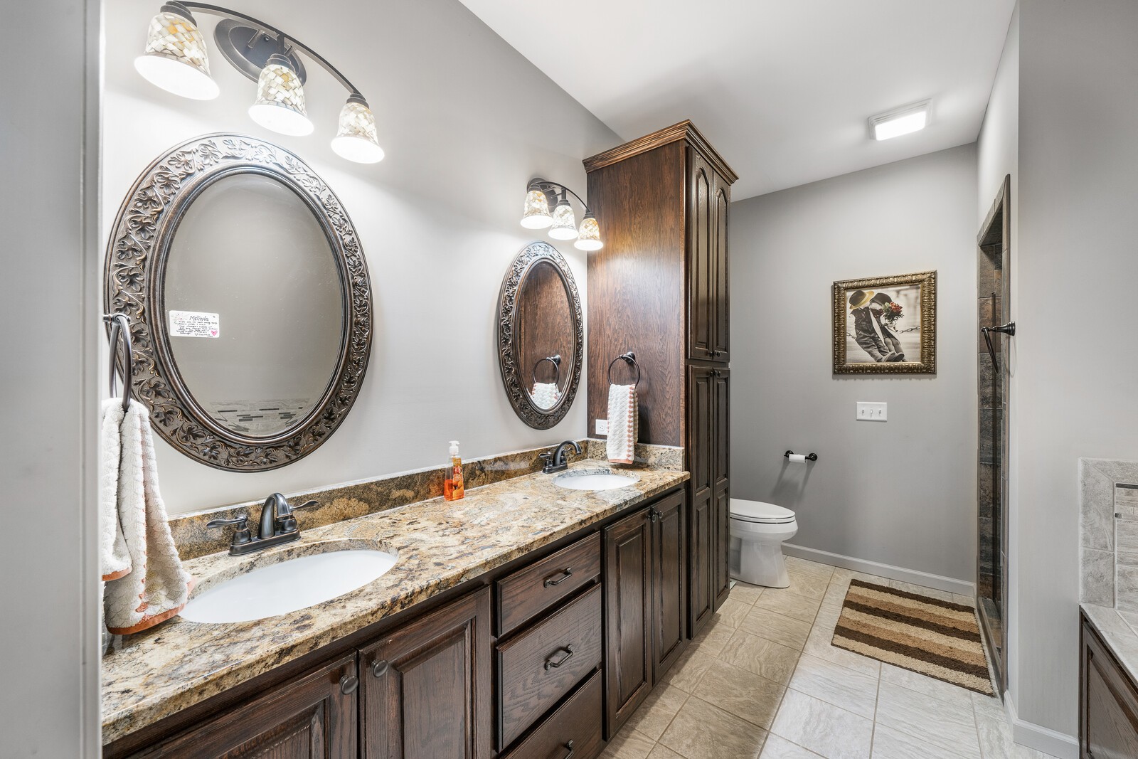 642 Campground Road Livingston, TN 38570 - Photo 12 of 49 a bathroom with a granite countertop toilet a sink and a mirror