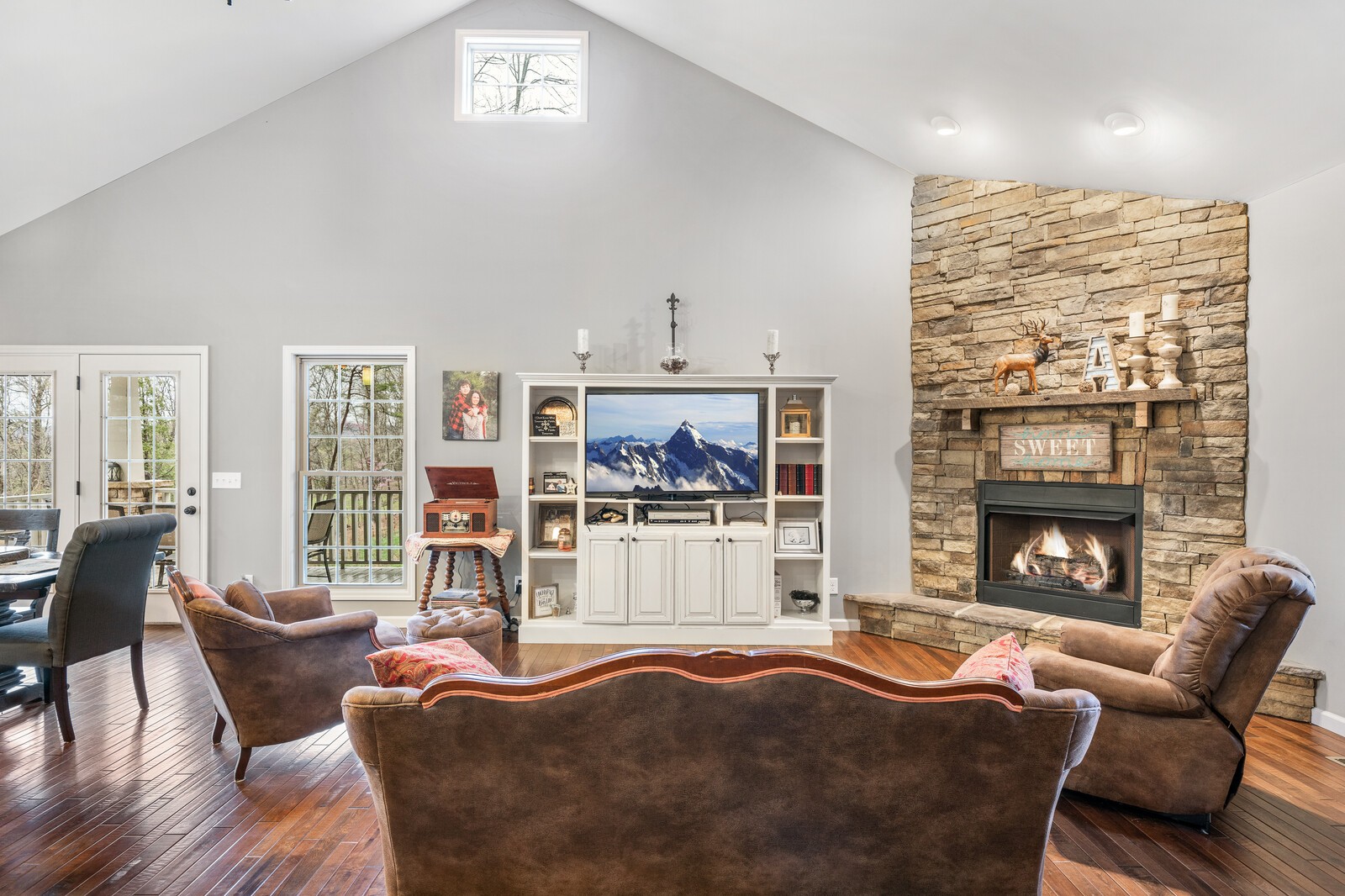 642 Campground Road Livingston, TN 38570 - Photo 3 of 49 a living room with furniture a fireplace and a floor to ceiling window