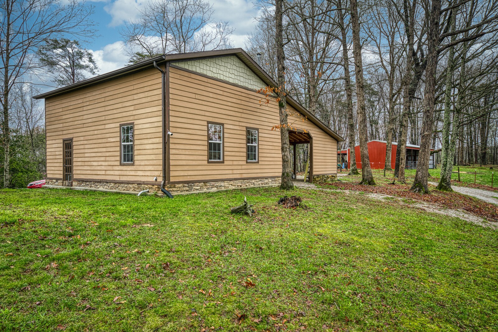 642 Campground Road Livingston, TN 38570 - Photo 32 of 49 a backyard of a house with barbeque oven