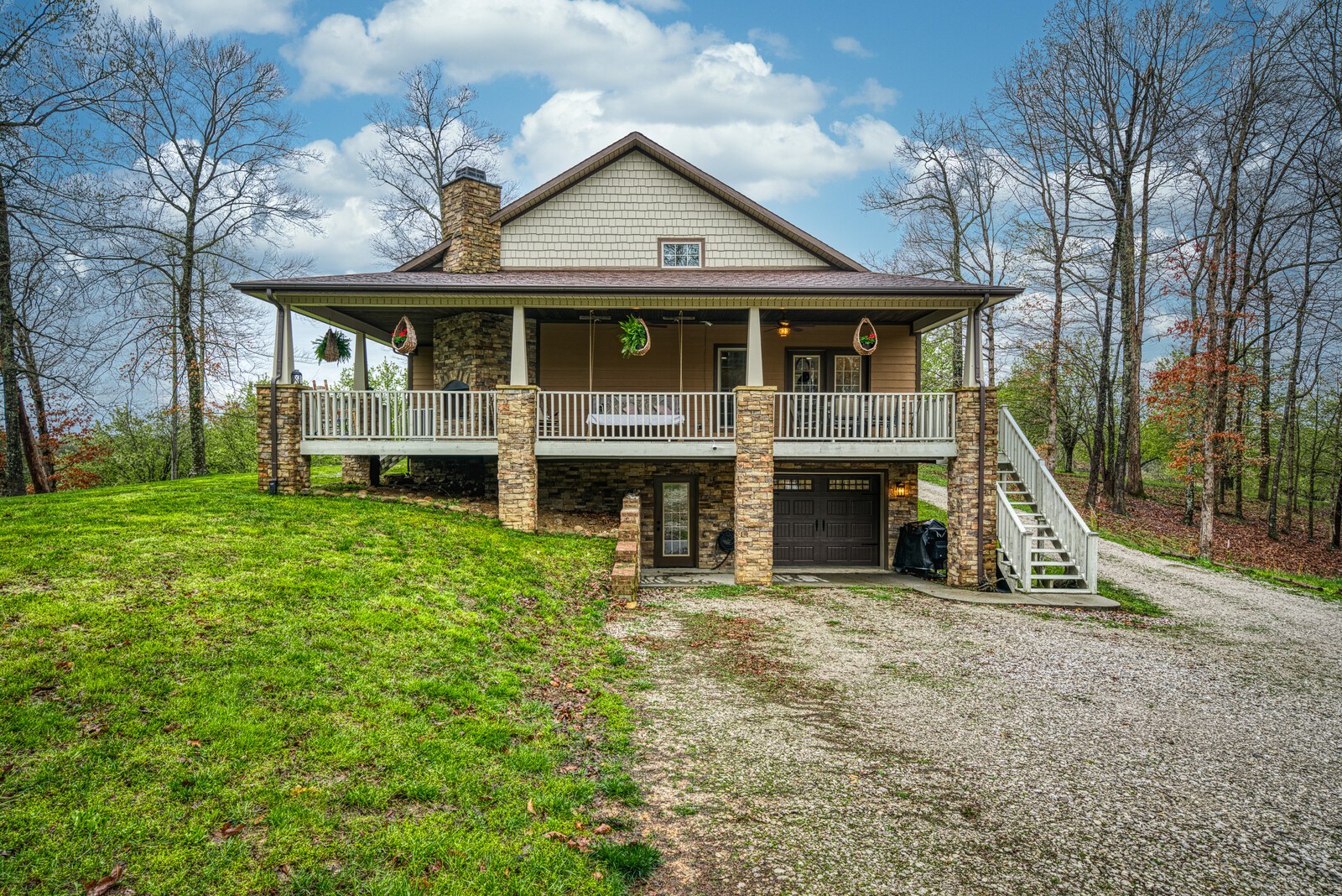642 Campground Road Livingston, TN 38570 - Photo 35 of 49 a view of a yard in front of a house with large windows