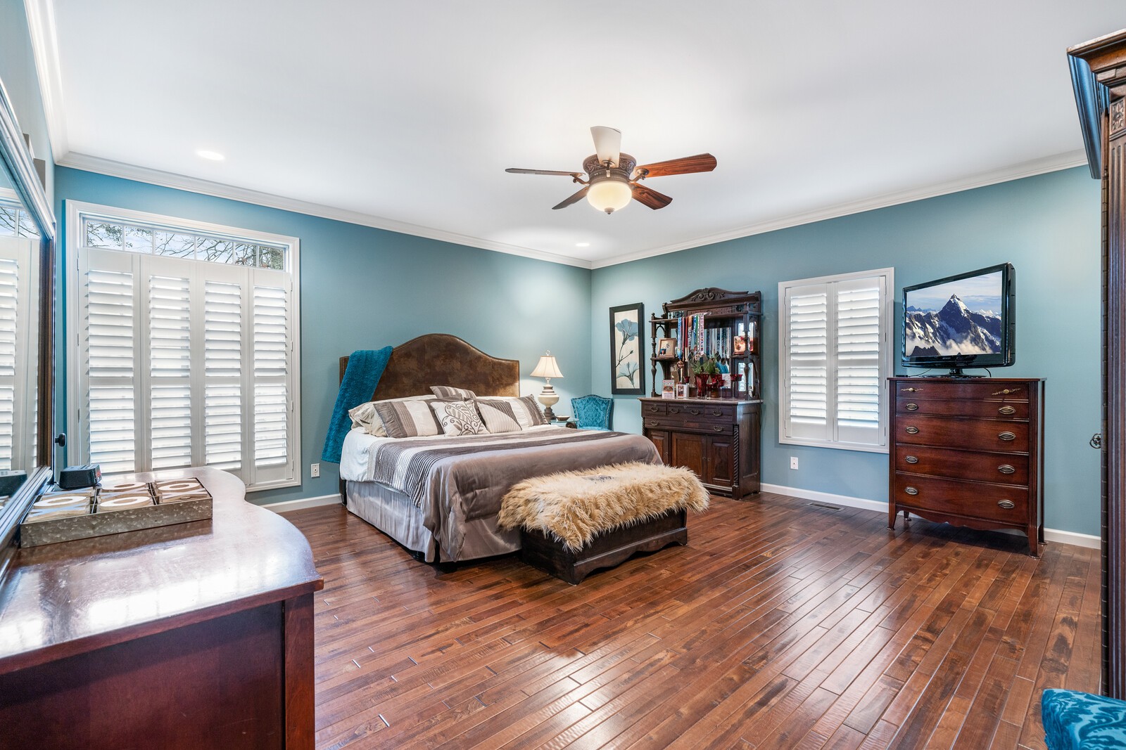 642 Campground Road Livingston, TN 38570 - Photo 10 of 49 a spacious bedroom with a bed and a flat tv screen on the dresser