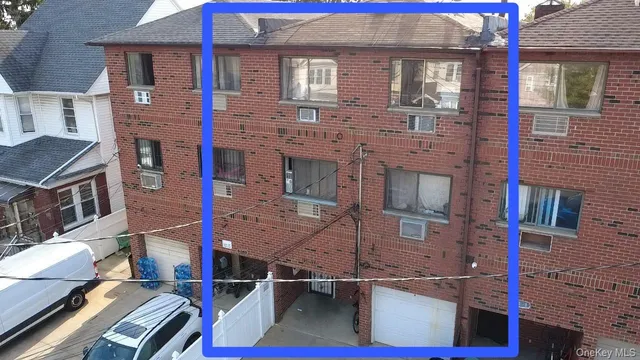 a aerial view of a brick building with a lot of windows