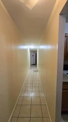 a bathroom with a glass door shower and a yard