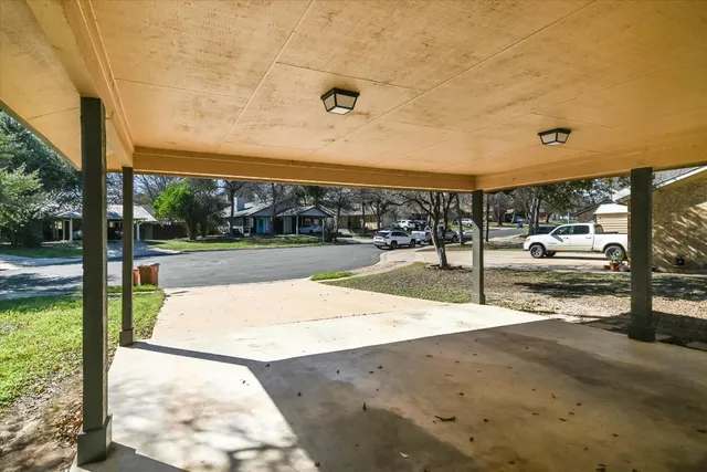 a view of a swimming pool with a patio