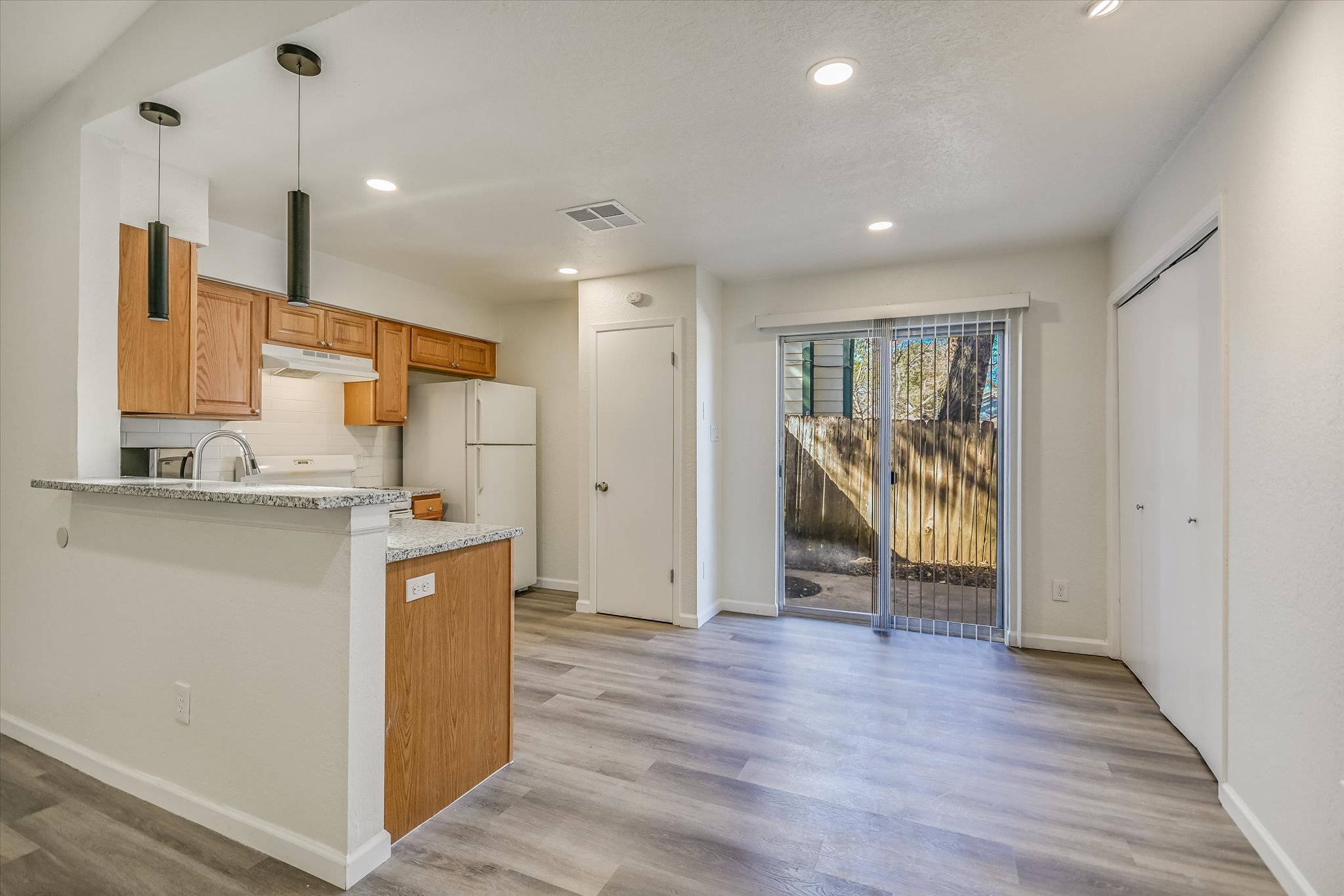 1402 Waterloo Trail, Unit A Austin, TX 78704 - Photo 6 of 15 a view of a kitchen with wooden floor and a sink