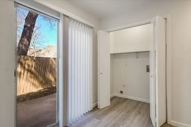 a view of a room that has a large window