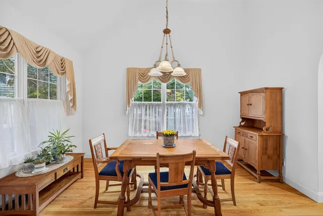 a bedroom with a bed and a lamp on table