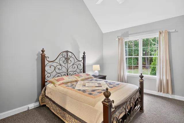 a bedroom with a bed and a table in it