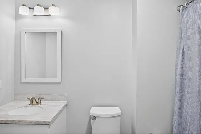 a living room with a couch and a dining table