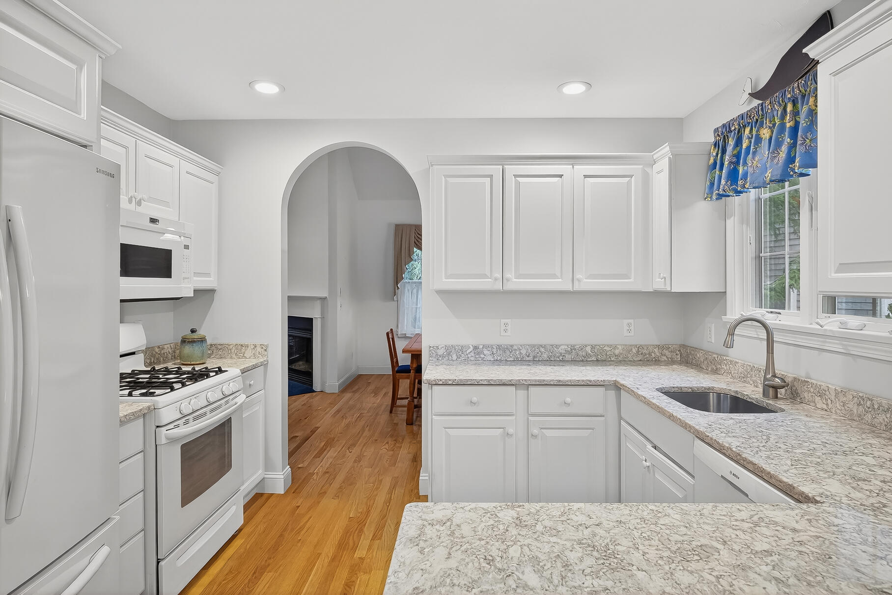6 Mayfair Court Mashpee, MA 02649 - Photo 10 of 53 a kitchen with stainless steel appliances granite countertop a sink stove and cabinets